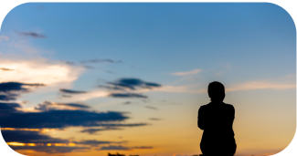 woman sitting down reflecting on her life